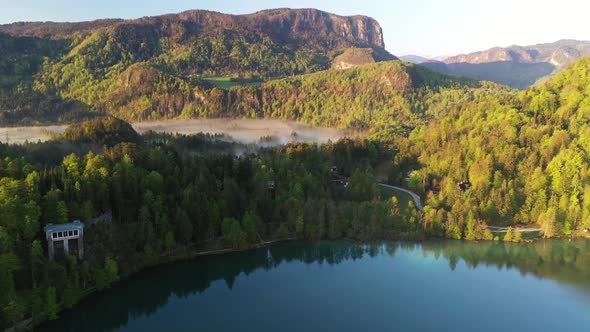 Flying over lake Bled towards the hills and mountains