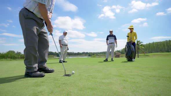 4K Group of Asian people golfer golfing together at country club.