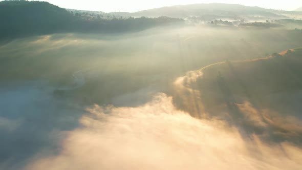 4K Aerial view flying in fog. flight above clouds.