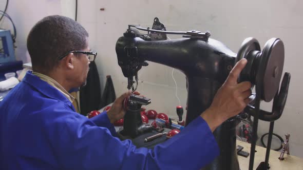 Mixed race man working in factory