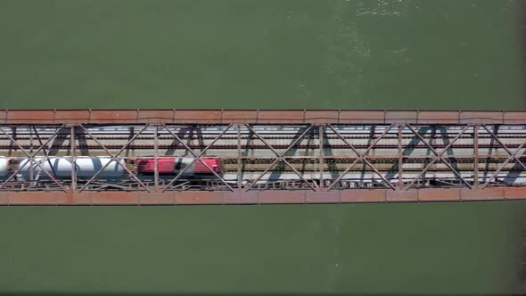 Bird's Eye View of a Freight Train Crossing A Bridge