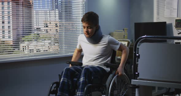 Teenager Patient Sitting in Wheelchair in Hospital