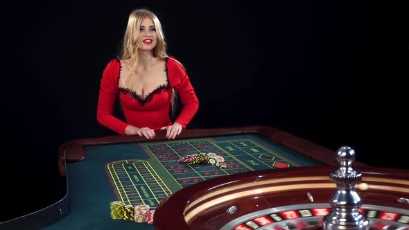 Young Woman Playing in Casino. Black. Slow Motion