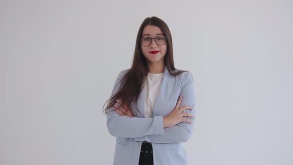 Ambitious Young Business Lady Stands with Her Arms Crossed on Her Chest and Shakes Her Head From