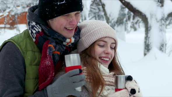 Couple Drinking Tea Coffee Cup in the Winter