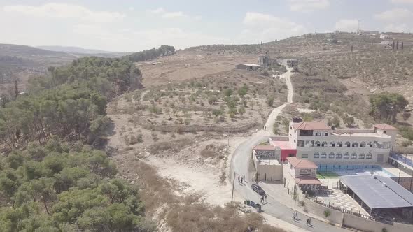 Aerial view of a building with a dried up pool in Arraba Palestine