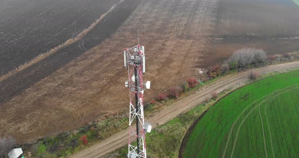 Drone Orbiting At The Relay Tower With Antennas On The Countryside