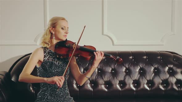 Woman in Evening Dress Playing the Violin