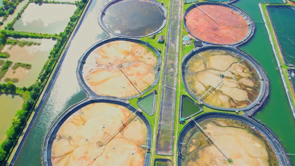 An aerial view of a drone flying over a large shrimp farm