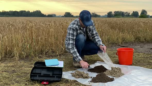 Farmer Filling Sample Bag with Soil Preparing Material for Analysis