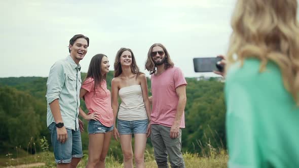 Happy Friends Taking Photos On Phone In Nature.