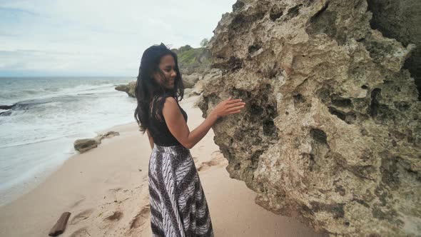 Indonesian Girl Posing on a Beautiful and Rocky Beach in Bali