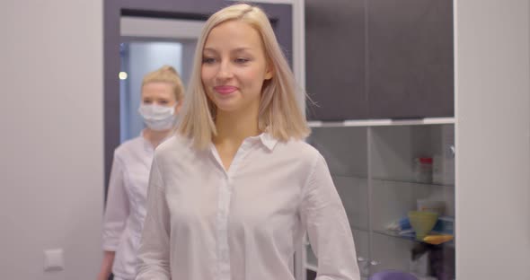 Beautiful Woman Enters the Doctor’s Office and Sits in a Chair