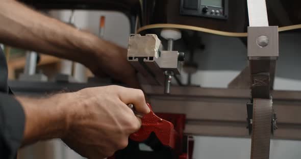 Luthier Mounts the Acoustic Guitar on the Jig at the Musical Instruments Repairing Shop  60p 10 Bit