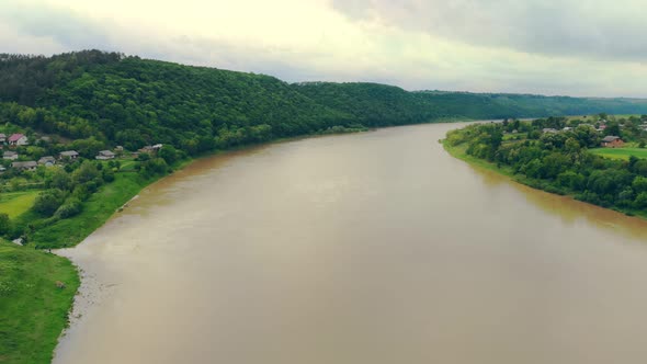 Aerial View a Large River Is Flooded with Dirty Water During Floods.