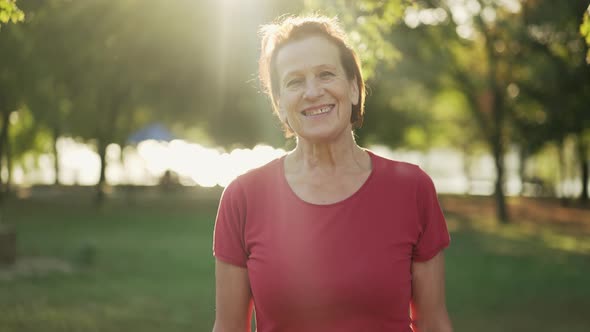 Smiling Aged Woman at the Sunset