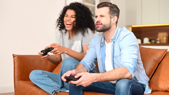 A Multiracial Couple Playing Video Game Together