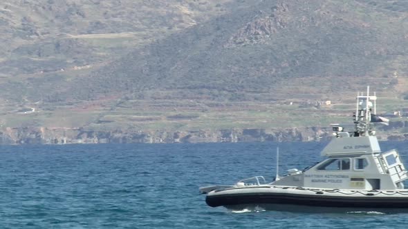 Close view of a police marine boat driving across the sea on the coast on Cyprus