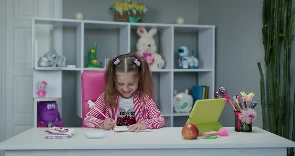 Preschool Girl Watching Lesson Online and Studying from Home