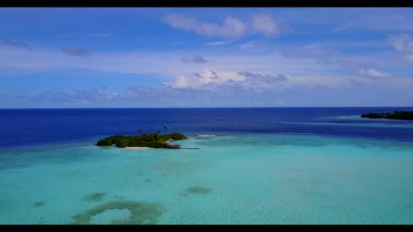 Aerial drone shot texture of idyllic island beach break by blue lagoon with white sandy background o