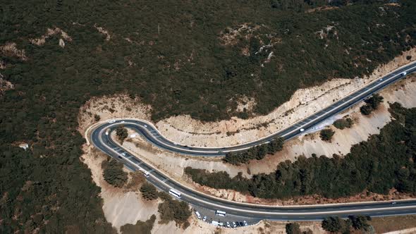 Aerial View of Serpentine Mountain Road with Cars Traffic