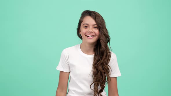 Portrait of Happy Teen Girl Long Curly Hair Having Fun and Laughing on Joke Joking