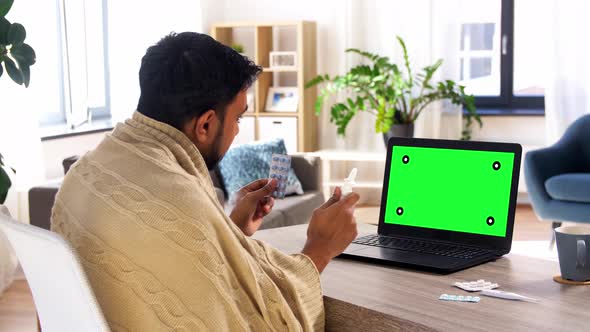 Sick Man with Medicine Having Video Call on Laptop