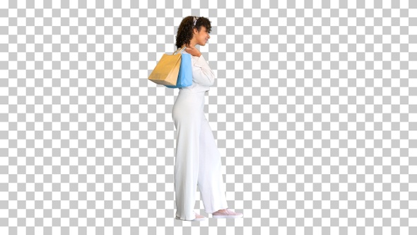 Young black lady carrying shopping bags, Alpha Channel