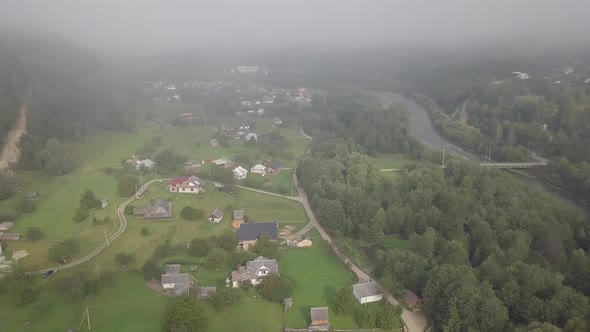 Aerial summer view to Carpathian village Kryvorivnia amidst mountains