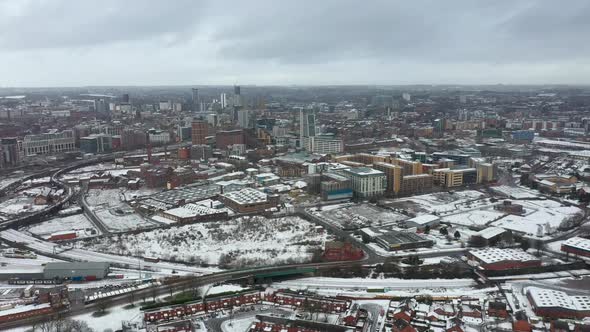 Aerial footage of a snowy winters day in the city of Leeds in the UK