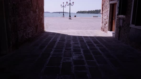 Motion Between Old Buildings To Waterfront Near Azure Sea