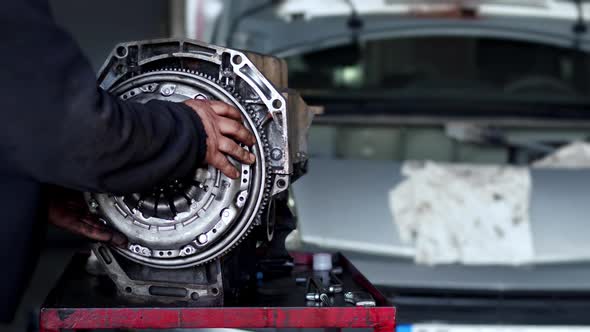 Volant Gear Is Installed In The Refurbished Car Engine In The Auto Repair Shop 2