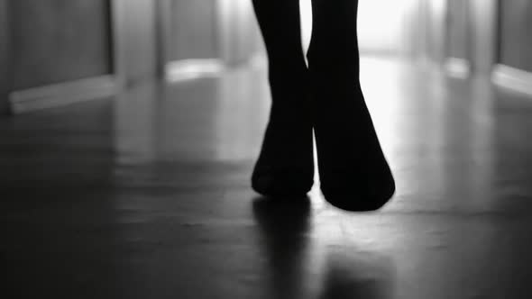 Silhouette of Female Legs Walking