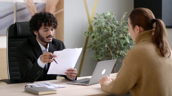 Serious Successful Indian HR Manager Entrepreneur Interviewing Girl in Modern Office