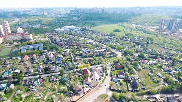 Flight drone over the Moscow region. Bird's eye view. Aerial survey of the village.