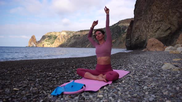 Young Woman with Black Hair Fitness Instructor in Leggings and Tops Doing Stretching and Pilates on