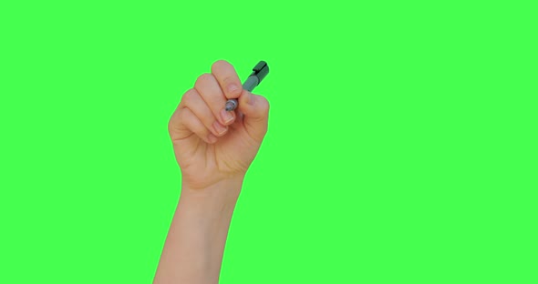 Female hand writing check mark symbol with pen, President election positive vote, Green screen