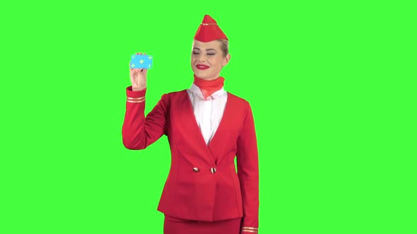 Girl Raises a Card and Shows a Finger Up. Green Screen