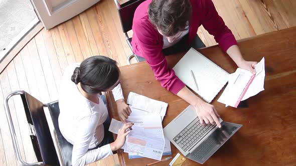 Couple discussing financial statements