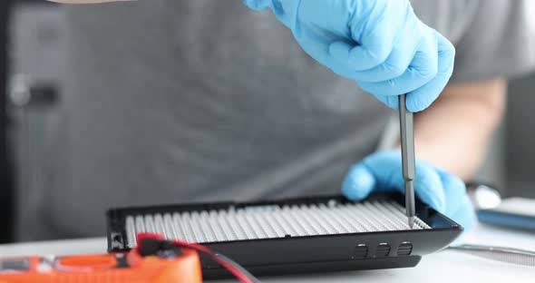 Master Repairing Led Lamp in Workshop Closeup  Movie Slow Motion alt