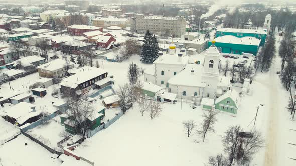 Beautiful Snowcovered Town and Church Winter Landscape Aerial View