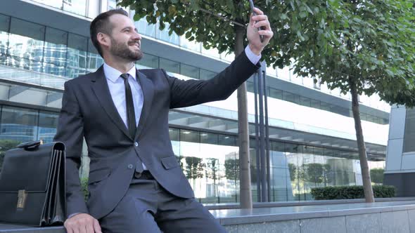Businessman Taking Selfie on Phone