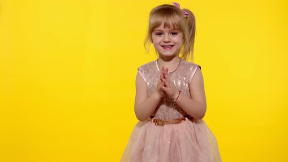 Little Blonde Child Girl 5-6 Years Old Smiling, Dancing, Celebrating on Yellow Studio Background