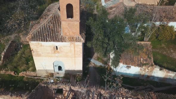 Aerial view of an abandoned village with a church in Spain.