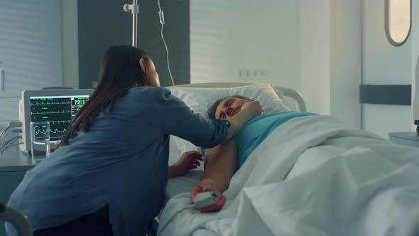 Wife Sitting Sick Patient at Hospital Ward