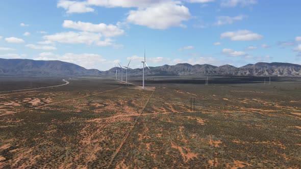 Drone aerial parallax of renewable energy wind farm in desert country Australia on a sunny day.mp4