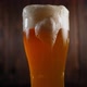 Closeup of a Glass of Light Beer with a Lot of Foam Flowing Down the Glass - VideoHive Item for Sale