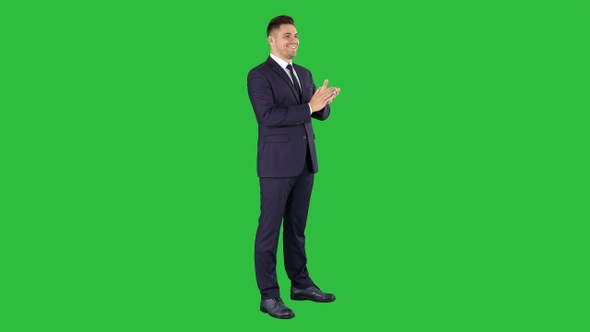 Businesses man applauding on a Green Screen, Chroma Key.