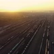 A Drone Camera Rises Above a Railway Sorting Station at Sunset - VideoHive Item for Sale