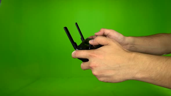 Hand Man with the Remote From the Copter Controls Him. Green Screen. Side View